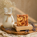 Velvet Mist soap on wooden soap dish with goat milk jug and lavender