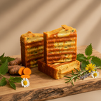 Verdelle soap bars on wooden board with nettle turmeric and wildflowers gift presentation