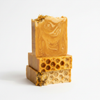 Three Golden Meadow honey turmeric soap bars on white background studio shot