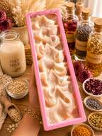 Mabrielle Aloura Botanical Feminine Care Bar handcrafted in pink soap mold with oat milk, rose, lavender, calendula and chamomile ingredients
