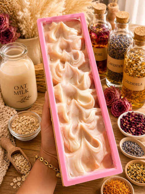 Mabrielle Aloura Botanical Feminine Care Bar handcrafted in pink soap mold with oat milk, rose, lavender, calendula and chamomile ingredients